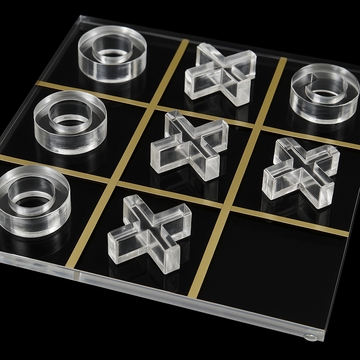 Lucite acrylic Tic Tac Toe board with clear X and O pieces on black background