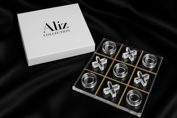 Lucite Tic Tac Toe game set with Aliz Collection packaging on black satin fabric