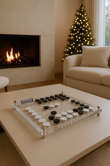 Lucite Othello game set displayed on a modern coffee table